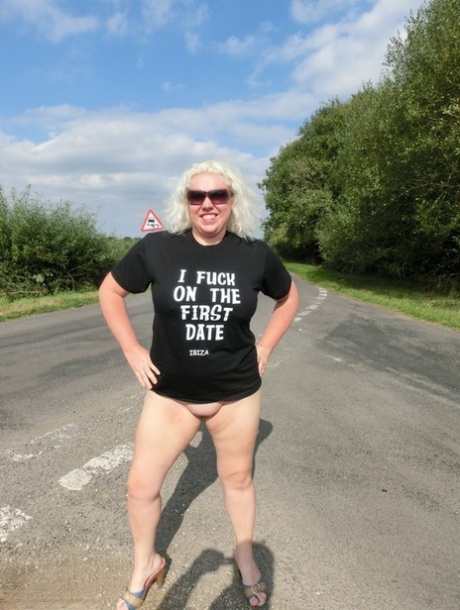 Older platinum blonde Barby gets naked along the side of a road in shades 72148175