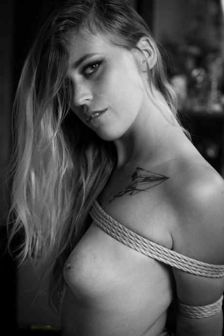Caucasian female Melody poses for a nude shoot while tied up with rope 98623446