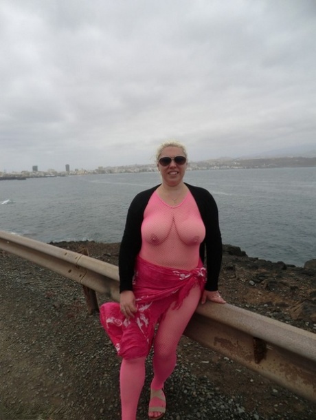 Aged lady Barby looses her big tits from a crotchless bodystocking by the sea 94510070