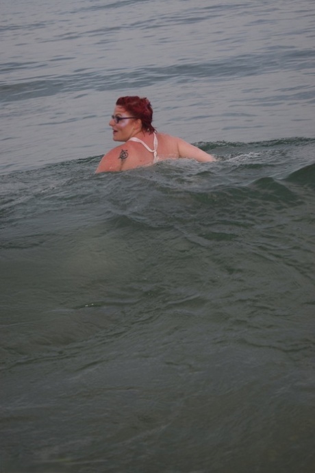 Tattooed redhead poses nude on a beach before masturbating on a toilet seat 35790241
