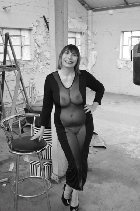 Middle-aged woman Barby Slut models a see-thru dress for a black-and-white gig 59278034