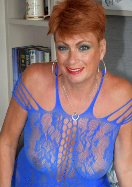 Mature redhead Dimonty sets her tits and twat free of lingerie in stockings 41940372