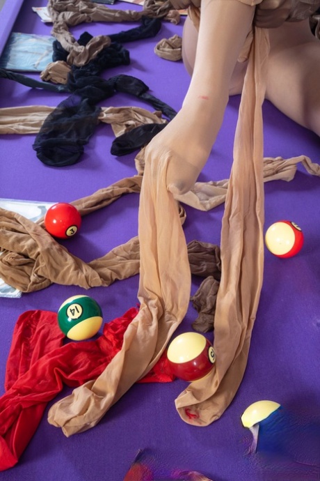 Solo girl Ally encases herself in pantyhose on top of a pool table 11609499