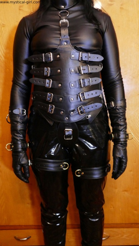 Caucasian lady models black fetish clothing during a solo performance 66178506