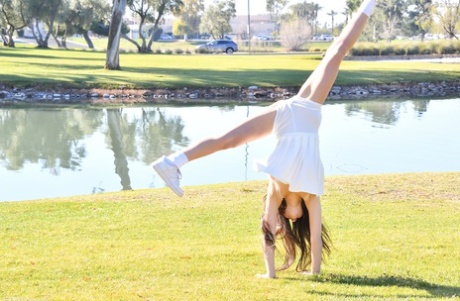 Brunette amateur Dakota does a cartwheel in a park before getting naked 84680431