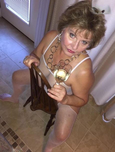 Mature lady Busty Bliss shows her cunt while wearing a crotchless bodystocking 12806325