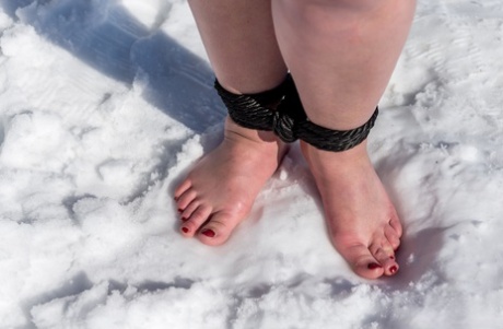 BBW solo girl is ball gagged and bound on snow-covered ground in the nude 51410777