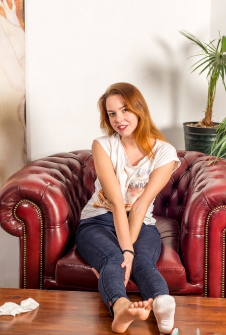 Natural redhead Lera Candy sports freshly painted toenails while going nude 52346041