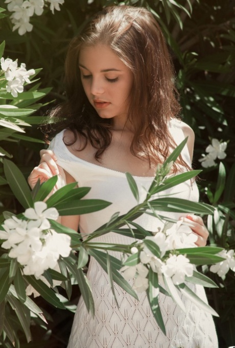 Beautiful girl Darien Grey pauses to get naked and sniff the flowers 34575476