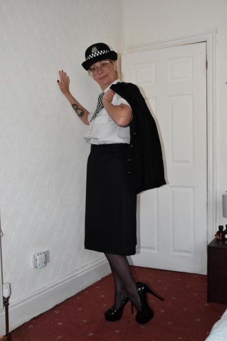 British policewoman Barby Slut masturbates on her bed in stockings 49865912