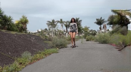 Hot girl Sexy Lexy squats for a piss on a paved road during the day 53861096