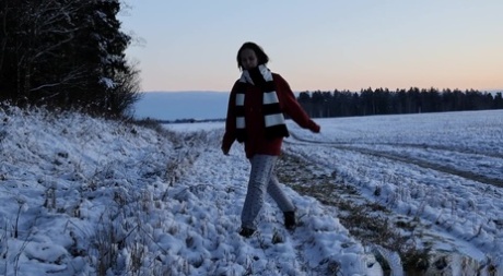 Nice girl Pinkycat takes a badly needed pee on snow laced ground 64789149