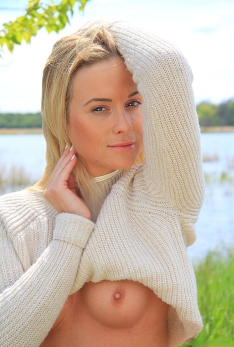 Blonde teen Cristal Caitlin shows her small tits and bald pussy near the water 32916678
