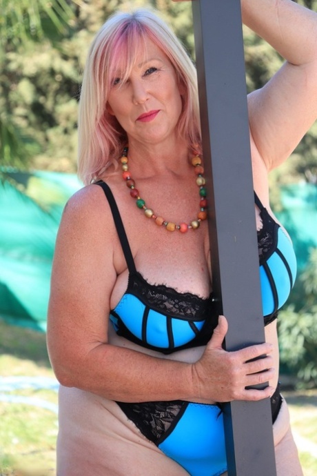 Older blonde fatty Melody poses outdoors in a bra and panty ensemble 34564997