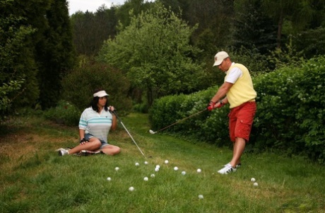 Thick Asian female bares her big tits while having sex with a golf instructor