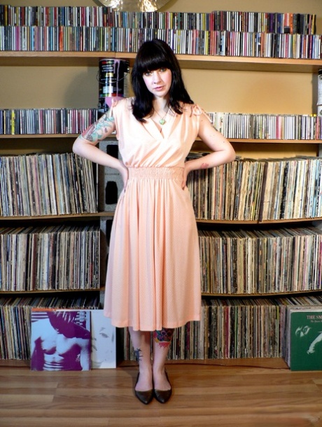 Tattooed model Anouck strips naked in front of her vinyl collection 49886950