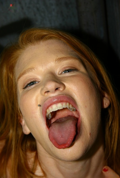 Young redhead Madison Young sucks off a BBC via a bathroom gloryhole 22793582