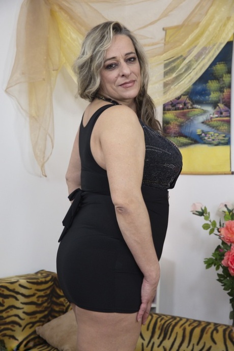 Fat older woman is convinced to show off her large boobs on her sofa 64028355