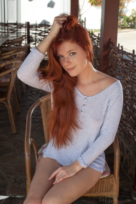 Pale redhead Mia Sollis showcases her bald pussy after disrobing 69415237