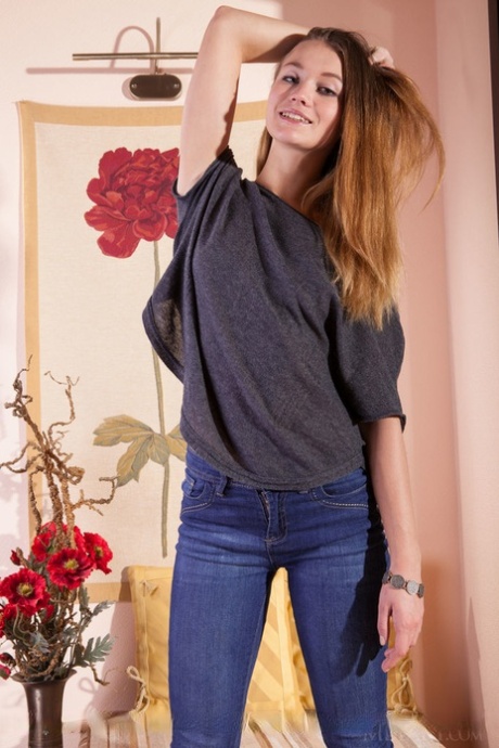 Fully clothed model Solveig shedding denim jeans to pose in the nude 82570476