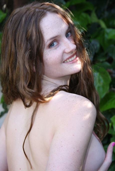 Teen girl with freckles on her face works free of jean shorts for nude poses 63180521
