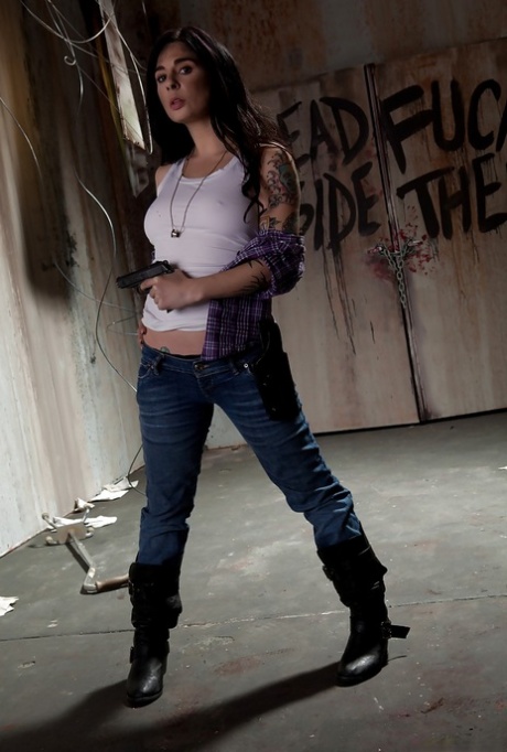 Sassy tattooed brunette in blue jeans revealing her jugs and inviting cunt 95946077