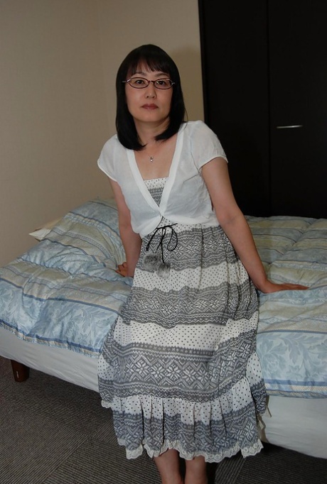 Shy asian lady in glasses strips down and has some pussy vibing fun 85398587