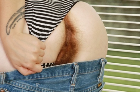 Ugly redhead MILF undressing and exposing her hairy armpits and twat 50966431