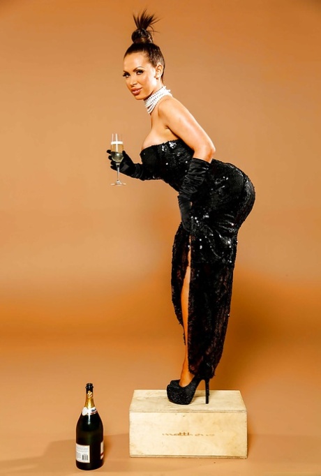 Hot milf Nikki Benz poses in her black dress with a wineglass 28150823