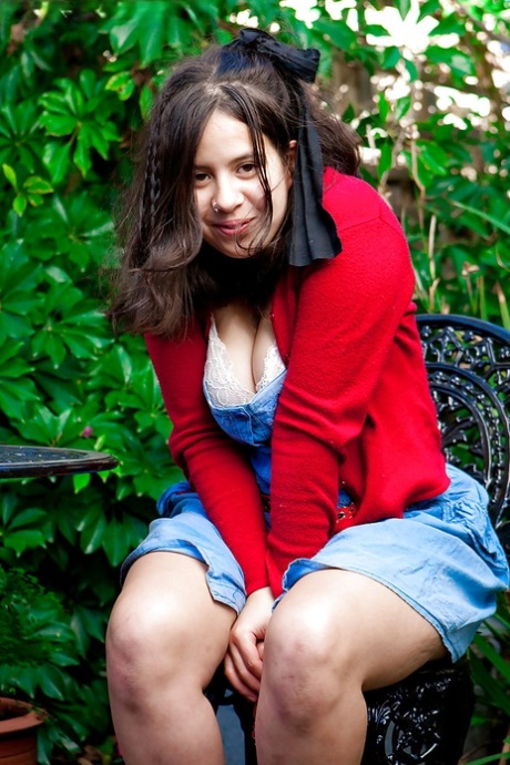 Young amateur girl Nikki S shows off her fat rolls after undressing outside 10095628