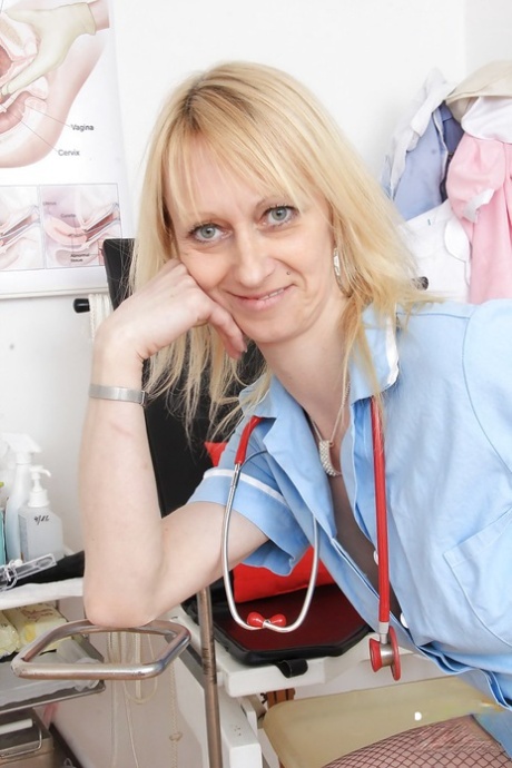 Mature nurse Nelly stripping off uniform and masturbating shaved pussy 58704597