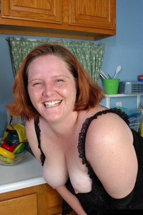 Fat redhead mature MILF Adrienne showcasing her big ass in stockings 32751302