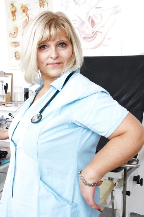 Older obese nurse freeing hairy cooter from uniform for toying session 72469742