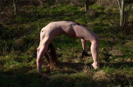European pornstar Olga Cabaeva makes a nude show outdoors exposing hairy cunt 65643243