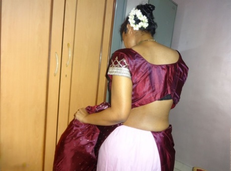 Clothed Indian woman strips to her black bra and underskirt 46627943