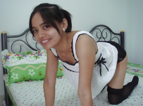 Pretty asian babe Lana Lane taking off her dress and lingerie 36773522