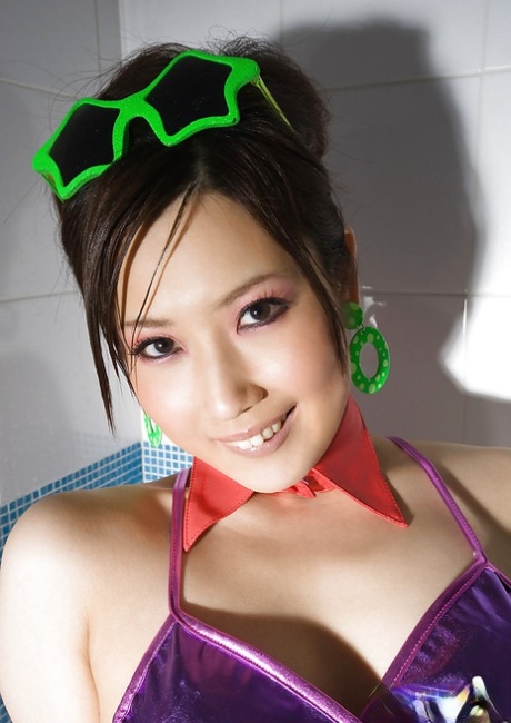 Asian babe Haruka Yagami lowering her fishnet pantyhose and panties 83075192