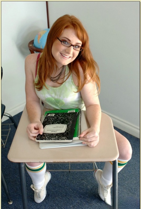 Redheaded college girl in glasses Lucy Fire fondling her little pussy 55050727