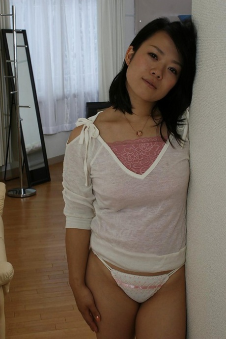 Asian gal Tomoe Asai strips down and has some pussy toying and fingering fun 40089833
