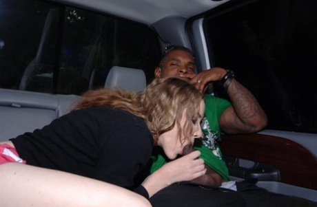 Chippy chick Audrey Elson gives a blowjob on a stiff black cock in the car 59663844