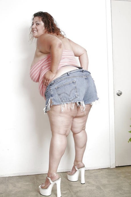 Extra large latina lady in jeans shorts undressing and spreading her lower lips 60000553